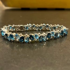 Women’s Sapphire and Diamond tennis bracelet.